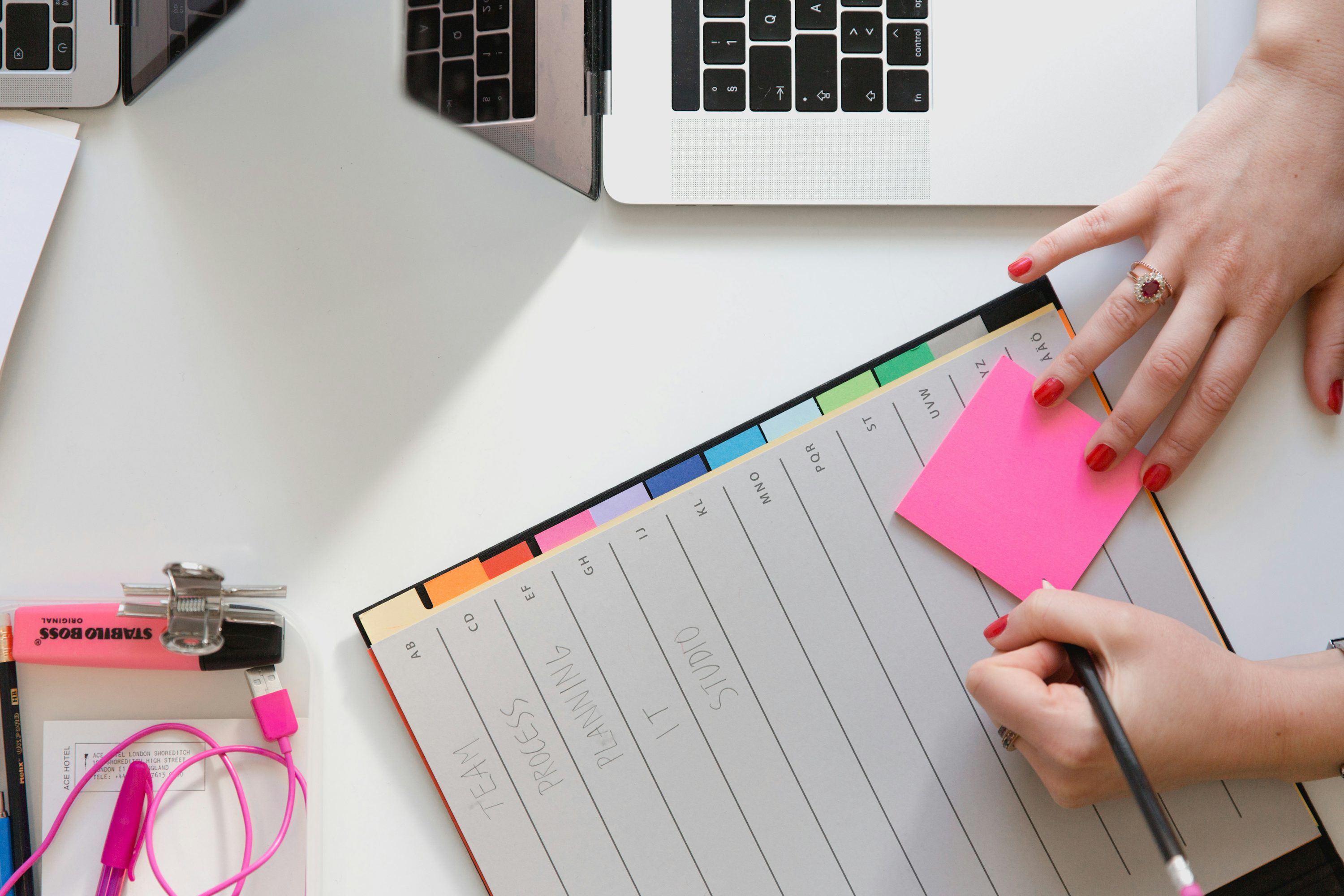 Teacher writing a lesson plan with curriculum documents